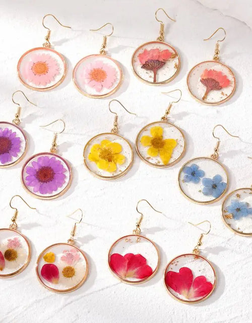 Load image into Gallery viewer, Handmaking Epoxy Resin Earrings With Flower Inside Unique Pressed Flower Earring Elegant Irregular Round Earrings Wholesale 2024
